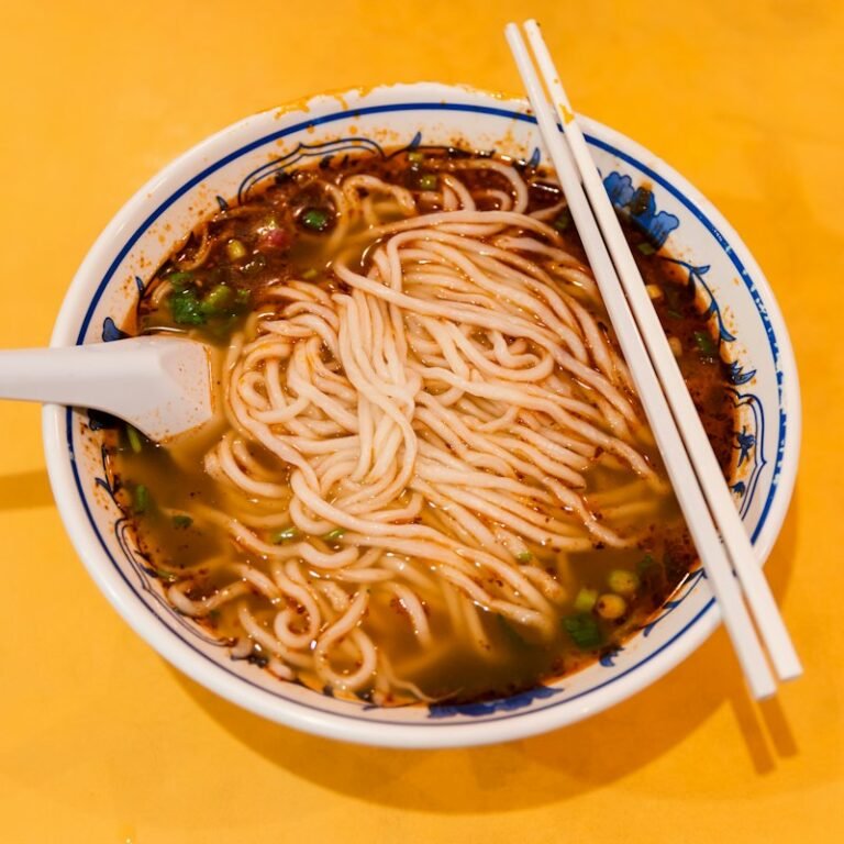 Bowl of noodles with chopsticks
