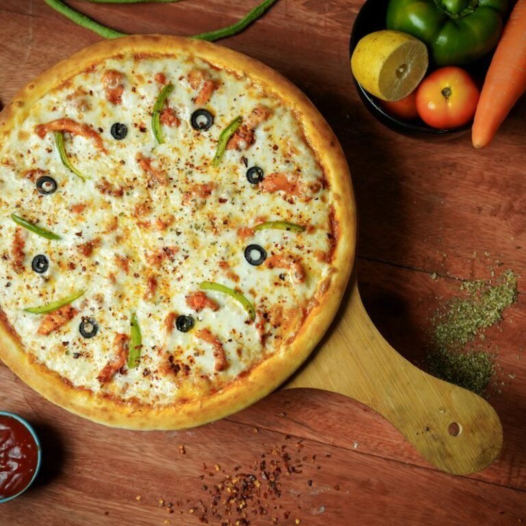 Pizza with melted cheese and olives